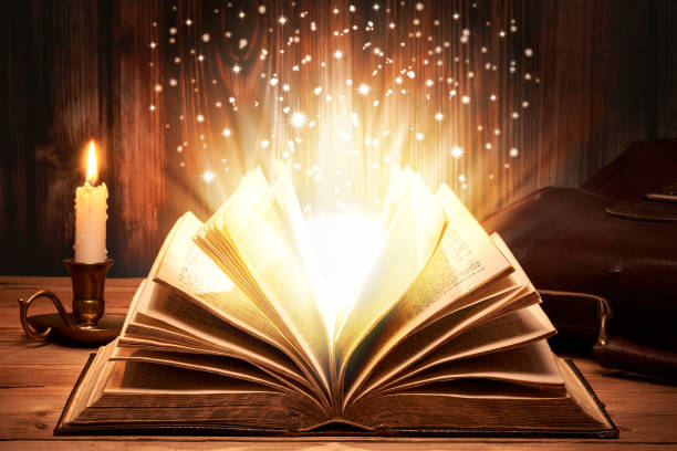 magical old book with sparkles - wizardry imagens e fotografias de stock