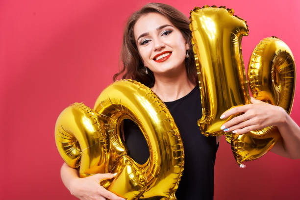 istock Young woman holding 2019 balloons in hands 1070694706