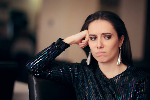 istock Sad Bored Glamorous Woman Having No Fun at Party 1070695814