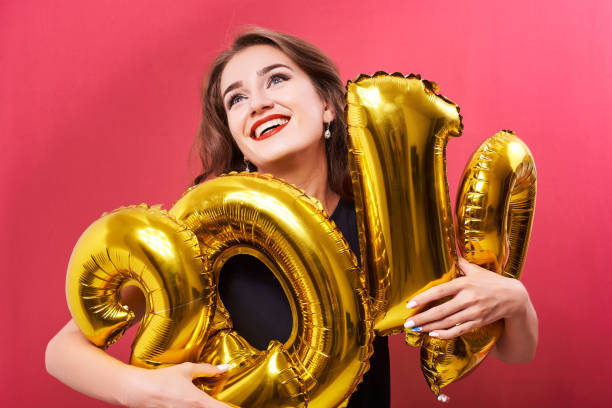 istock Young woman holding 2019 balloons in hands 1070696566