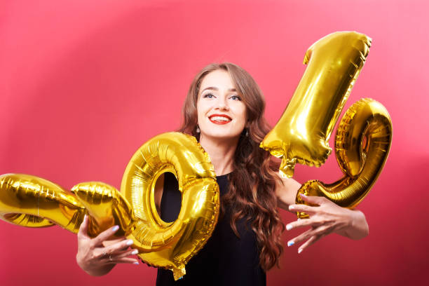 istock Young woman holding 2019 balloons in hands 1070697200