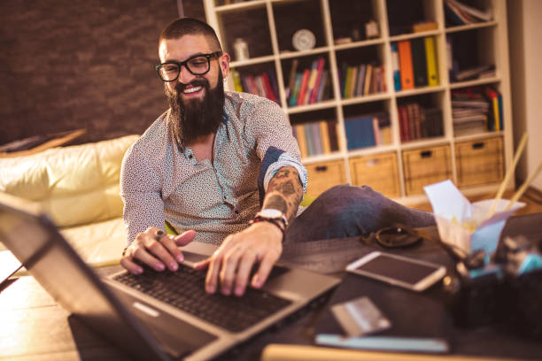 istock Young man working on his laptop computer at home 1070698796
