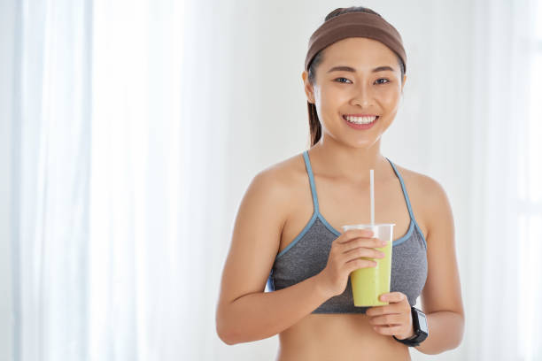 istock Beautiful Female Athlete With Drink 1070699508