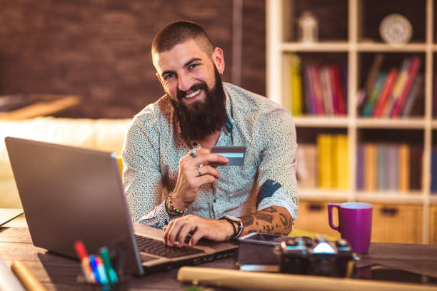 istock Designer working in office using credit card for online payment 1070702046