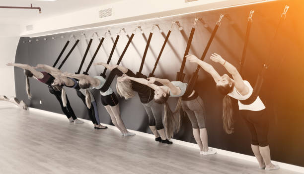istock Women exercising yoga wall on straps 1070703418