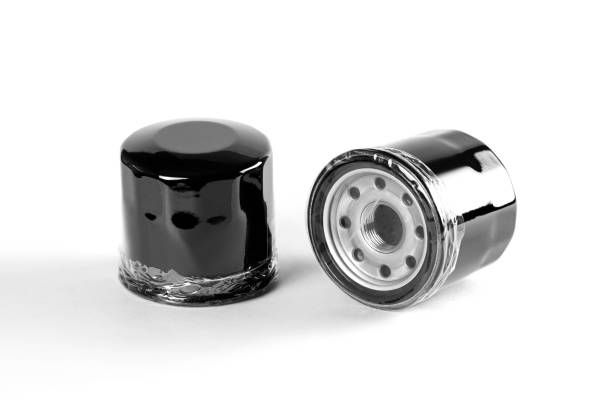 istock Two oil filters. Close up. Isolated on white background. 1070704034