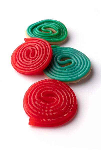istock Colorful licorice candy snails on white 1070704684