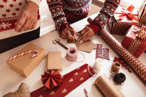 istock couple preparing the packages for christmas 1070704782