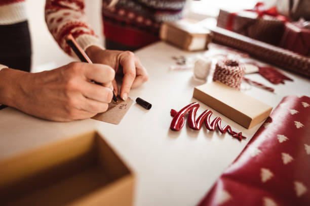 istock couple preparing the packages for christmas 1070704864
