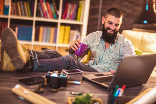 istock Young man working on his laptop computer at home 1070704990