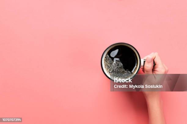 High Angle Of Woman Hands Holding Coffee Mug On Pink Background Minimalistic Style Flat Lay Top View Isolated Stock Photo - Download Image Now