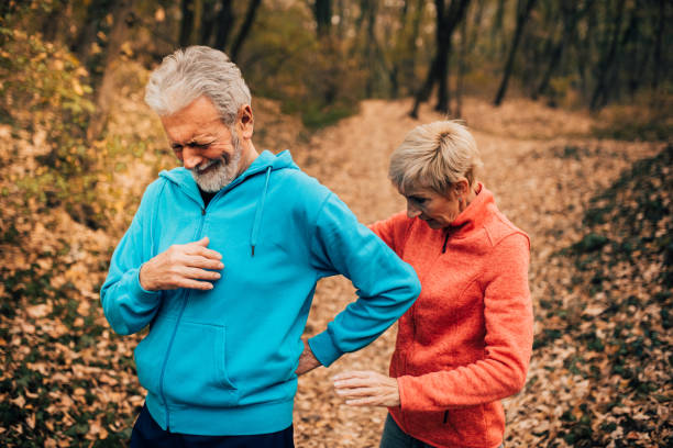 istock Senior fit man with back pain in a park 1070710886