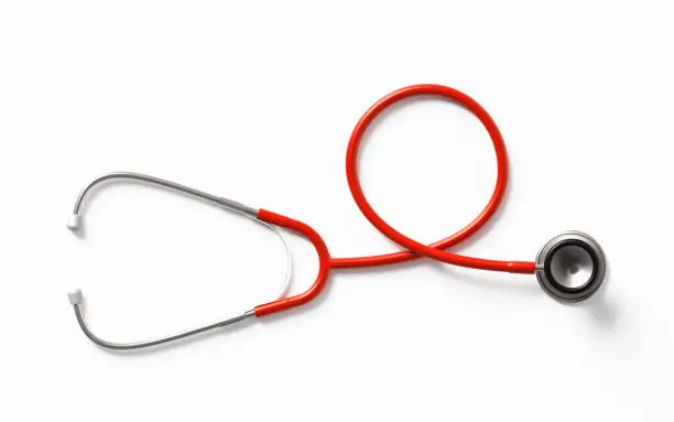 Red stethoscope on white background. Health concept. Horizontal composition with clipping path and copy space. Directly above.