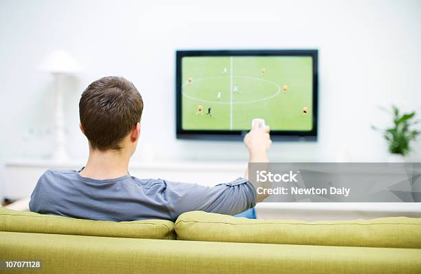 Man Watching Football On Television Stock Photo - Download Image Now - Watching TV, Soccer, Rear View