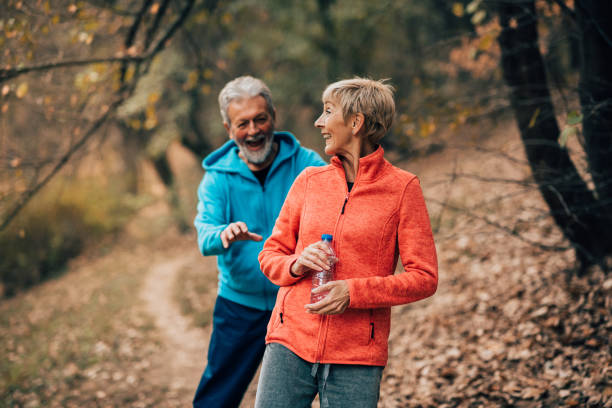 istock Senior couple walking in a park 1070712380