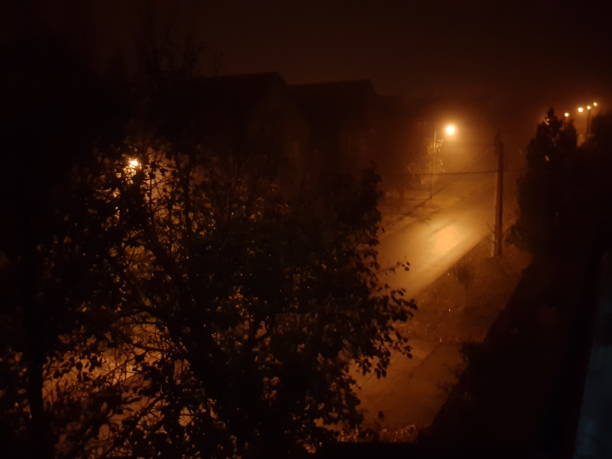 istock Foggy street at night 1070712494