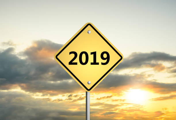 istock road sign 2019 on the sunset sky. 3D illustration 1070713672