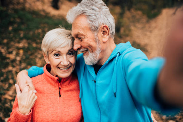 istock Senior couple making a selfie in a park 1070713834