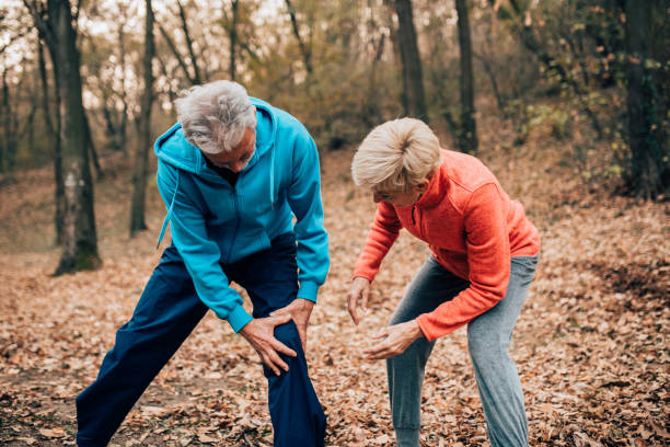 istock Senior couple exercising man with knee pain 1070714014