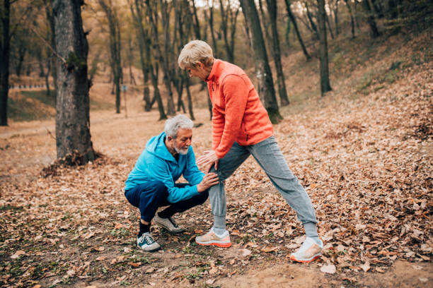 istock Senior couple exercising knees in a park 1070714030