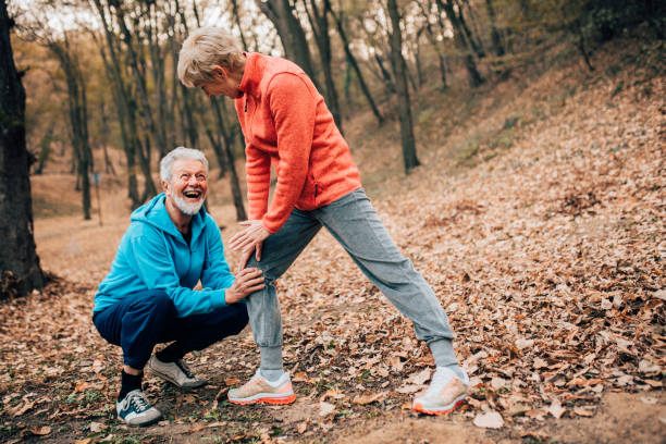 istock Senior couple exercising calf stretch in a park 1070714048