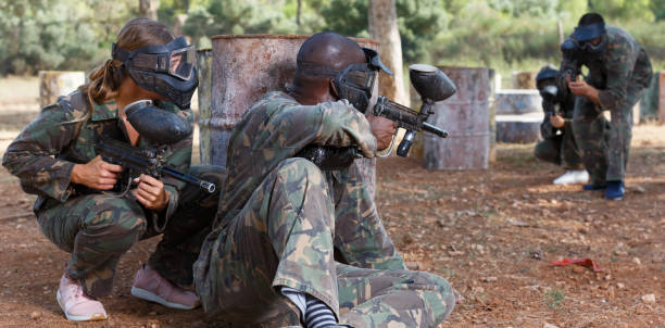 istock Teams facing in paintball arena 1070716630