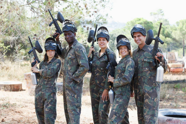 istock paintball players holding guns ready for playing 1070718320