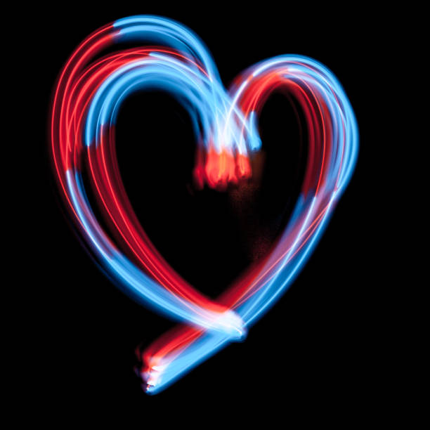 istock The heart-shaped digital neon lights are on the dark background 1070722598