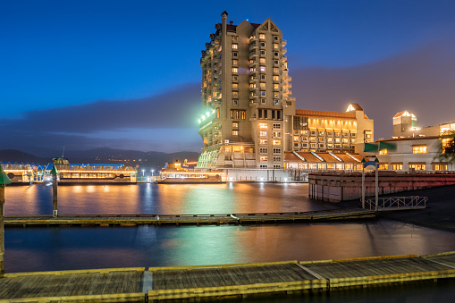 Waterfront with hotel and Lake Coeur d’Alene in downtown Coeur d'Alene Idaho USA at twilight.