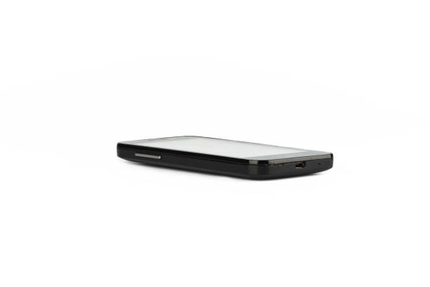 istock Old smartphone with scratches and broken plug 1070726484