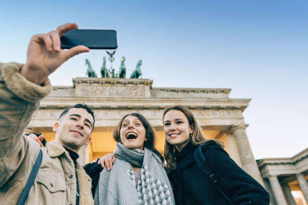 istock three young tourists taking selfie in berlin 1070727690