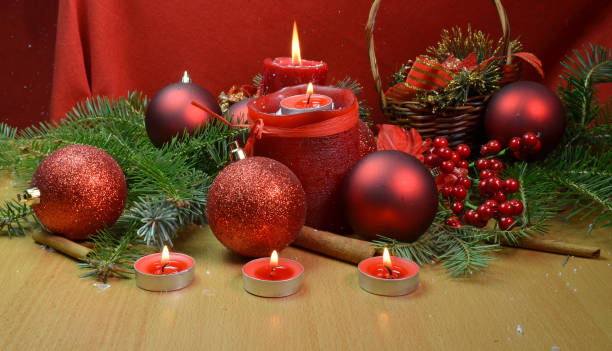 istock xmas canldes red snow chrismas for background 1070729124