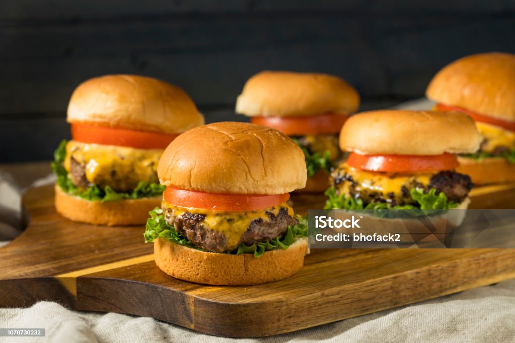 Homemade Cheeseburger Sliders with Tomato Homemade Cheeseburger Sliders with Tomato and Lettuce Slider - Burger Stock Photo