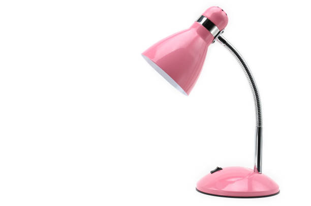 Pink colored table lamp on a white isolated background