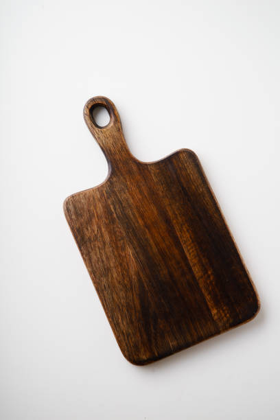 istock Cutting boards made of wood on white background with copy space 1070737422