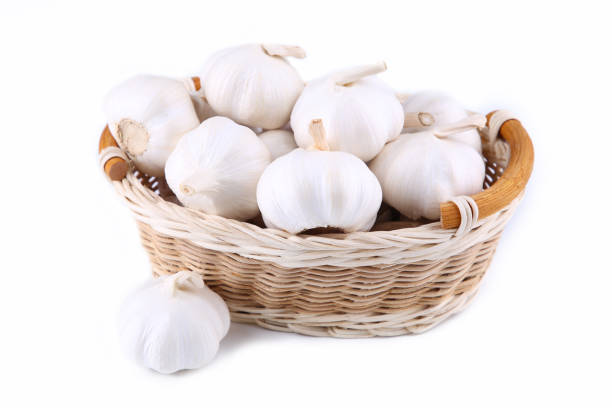 istock Isolated garlic.Fresh garlic in basket on white background 1070738478