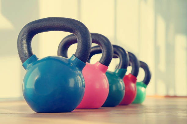 istock Colorful kettlebells in gym 1070741648
