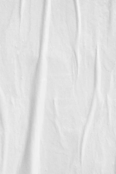istock Blank white old ripped torn paper crumpled creased posters grunge textures backdrop backgrounds surface placard - Stock image 1070741780