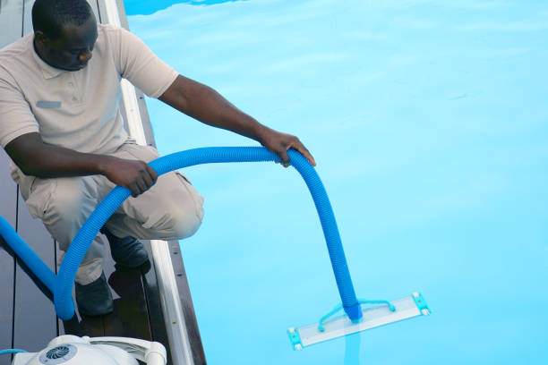 istock Hotel staff worker cleaning the pool 1070743222