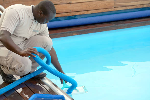 istock Hotel staff worker cleaning the pool 1070743456