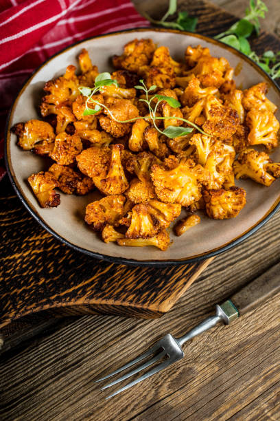 istock Cauliflower rosettes in a herbal marinade. 1070744332