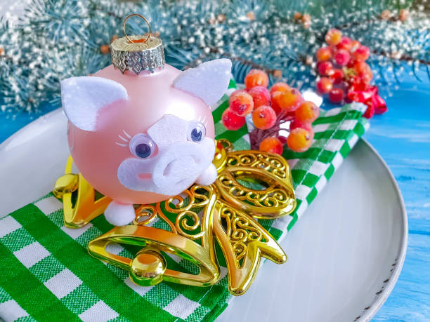 istock branch tree, plate, pig on a wooden background frame 1070745556