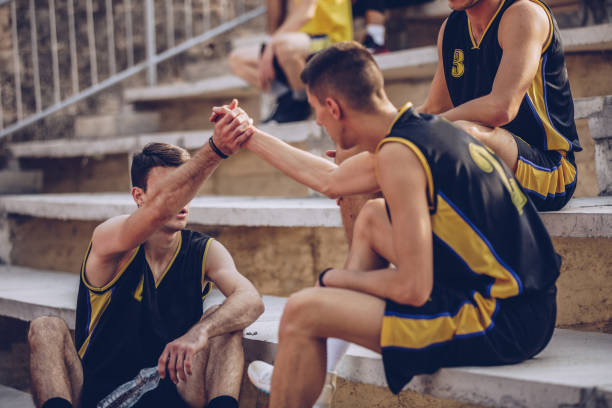 istock Basketball players sitting at the bench 1070745790