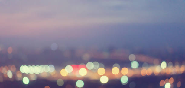 istock abstract blurred night city in evening sunset time with bokeh light as panoramic background for design element concept 1070752008