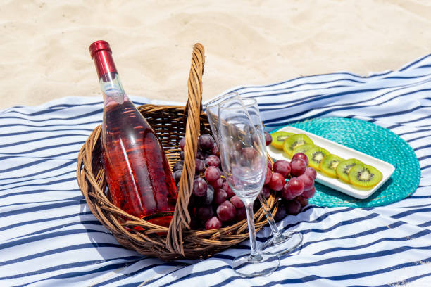 istock Beach picnic with wine and grapes 1070754376
