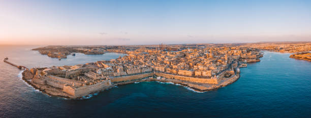 Amazing aerial panorama of the Valletta city, Malta. Amazing aerial panorama of the Valletta city, Malta. Flying over ancient town with huge defence walls and old port. valletta photos stock pictures, royalty-free photos & images
