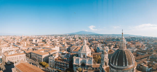 Beautiful aerial view of the Catania city near the main Cathedral Beautiful aerial view of the Catania city near the main Cathedral and Etna volcano on the background. Amazing old town view from above. tropical storm photos stock pictures, royalty-free photos & images