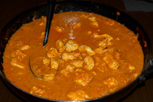 istock Chicken tikka masala  Indian on stovetop 1070760882