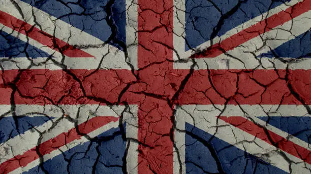 Political Crisis Or Environmental Concept: Mud Cracks With UK Flag