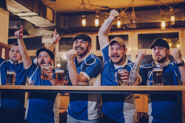 istock Fans watching game together in sports pub 1070767212